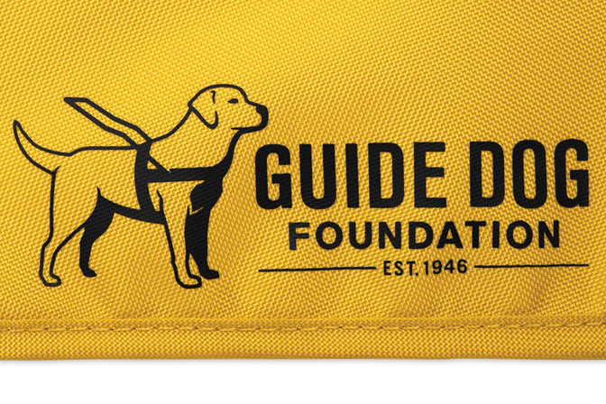 Close up of guide dog foundation logo printed on side of vest.